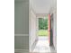 Sunlit entryway features tiled floors and a bright pink front door, flanked by coat closets at 1620 Matthews Dr, Rock Hill, SC 29732