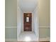 Inviting foyer features tiled floors, paneled walls and a gorgeous wood front door at 1620 Matthews Dr, Rock Hill, SC 29732