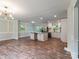 Open-concept kitchen features an island, stainless appliances, and hardwood floors at 1620 Matthews Dr, Rock Hill, SC 29732