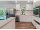 Modern kitchen features stainless appliances, white cabinets and an island with granite countertops at 1620 Matthews Dr, Rock Hill, SC 29732