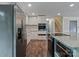 Gourmet kitchen features stainless appliances, modern cabinetry and hardwood floors at 1620 Matthews Dr, Rock Hill, SC 29732