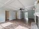 Open living area with detailed trim, fan, fireplace, and lots of natural light at 1620 Matthews Dr, Rock Hill, SC 29732