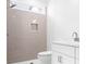 Modern bathroom features tiled shower, neutral paint, and white vanity at 17408 Summer Place Dr, Cornelius, NC 28031