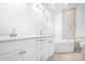 Bright bathroom features a double vanity, a soaking tub and accent tile at 17408 Summer Place Dr, Cornelius, NC 28031
