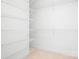 Spacious walk-in closet features an adjustable shelving system at 17408 Summer Place Dr, Cornelius, NC 28031