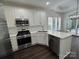 Well-equipped kitchen with stainless steel appliances and quartz countertops at 17408 Summer Place Dr, Cornelius, NC 28031