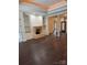 Spacious living room showcases hardwood floors, fireplace, and classic columns at 17408 Summer Place Dr, Cornelius, NC 28031