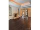 Elegant living room features a stone fireplace and built-in shelving at 17408 Summer Place Dr, Cornelius, NC 28031