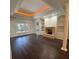 Bright living room boasts a cozy fireplace, built-in bookshelves, and hardwood floors at 17408 Summer Place Dr, Cornelius, NC 28031