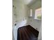 Mud room boasts wood floors, natural light, and storage cabinets at 17408 Summer Place Dr, Cornelius, NC 28031