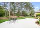 Outdoor patio area is perfect for entertaining with its ample seating and picturesque views of the trees at 17408 Summer Place Dr, Cornelius, NC 28031
