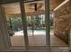 Relax in the screened porch with a brick accent wall and tiled floors at 17408 Summer Place Dr, Cornelius, NC 28031