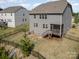 Aerial view of a fenced backyard and the home's exterior, showing the deck and surrounding neighborhood at 17502 Snug Harbor Rd, Charlotte, NC 28278