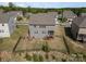 Aerial view of a fenced backyard and the home's exterior, showing the deck and surrounding neighborhood at 17502 Snug Harbor Rd, Charlotte, NC 28278