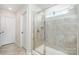 Bathroom features a tiled walk-in shower with glass door and a large window at 17502 Snug Harbor Rd, Charlotte, NC 28278