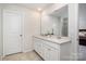 Bathroom features double sink vanity with quartz countertops and a large mirror at 17502 Snug Harbor Rd, Charlotte, NC 28278