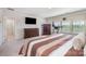 Bright bedroom features an exercise treadmill, and wood furniture at 17502 Snug Harbor Rd, Charlotte, NC 28278