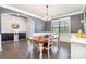 Dining room with hardwood floors, natural light, and stylish chandelier at 17502 Snug Harbor Rd, Charlotte, NC 28278