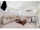 Cozy living room features a large sectional sofa, and built-in window seating at 17502 Snug Harbor Rd, Charlotte, NC 28278