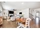 Open living space with hardwood floors, fireplace, dining area, and a comfortable seating arrangement at 17502 Snug Harbor Rd, Charlotte, NC 28278