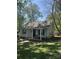 Charming single-story home with a covered front porch and a cozy, inviting feel on a sunny day at 1849 Brownstone St, Charlotte, NC 28216