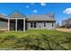 A lush green lawn with a screened porch area outside of a single-Gathering home at 2007 Mantle Ridge Dr # 192, Indian Trail, NC 28079