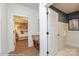 Hallway featuring wood floors and entryways into different rooms at 2007 Mantle Ridge Dr # 192, Indian Trail, NC 28079
