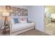 Cozy sitting area with a daybed, stylish decor, and a view into the bathroom at 2007 Mantle Ridge Dr # 192, Indian Trail, NC 28079