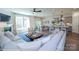 Open-concept space with modern kitchen, dining area, and cozy living room with fireplace and comfortable seating at 2007 Mantle Ridge Dr # 192, Indian Trail, NC 28079