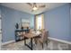 Home office area with a desk, comfortable chairs, and ample natural light at 2007 Mantle Ridge Dr # 192, Indian Trail, NC 28079