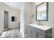 Stylish bathroom with walk-in shower, gray vanity, and wood-look flooring at 209 Sheffield Dr, York, SC 29745
