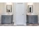 Bathroom featuring dual vanities with gray cabinets and wood-look flooring at 209 Sheffield Dr, York, SC 29745