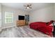 Bedroom features wood-look flooring, a window, and a dresser with a TV at 209 Sheffield Dr, York, SC 29745