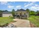 Charming home with a cozy front porch and ample parking space, surrounded by lush greenery and a serene atmosphere at 209 Sheffield Dr, York, SC 29745