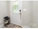 Entryway featuring the front door with decorative glass, with a shoe rack nearby at 209 Sheffield Dr, York, SC 29745