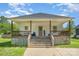 Inviting home featuring a covered porch and a well-maintained front yard at 209 Sheffield Dr, York, SC 29745