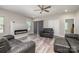 Spacious living room with an electric fireplace, ceiling fan, and gray leather furnishings at 209 Sheffield Dr, York, SC 29745