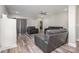 Open-concept living room with recessed lighting, ceiling fan, and modern gray furniture at 209 Sheffield Dr, York, SC 29745