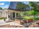 Backyard patio with outdoor furniture, wooden deck and landscaped lawn at 218 N Bost St, Statesville, NC 28677