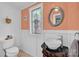 Charming bathroom with decorative window, vessel sink, and vintage vanity at 218 N Bost St, Statesville, NC 28677