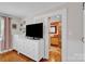 Cozy bedroom with view to en-suite bathroom and ample storage at 218 N Bost St, Statesville, NC 28677