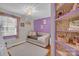 Bedroom featuring a daybed, area rug, and custom shelving at 218 N Bost St, Statesville, NC 28677
