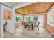 Cozy dining area with wood ceiling and many windows at 218 N Bost St, Statesville, NC 28677