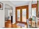 Inviting foyer with hardwood floors and decorative glass doors, creating an elegant and welcoming entrance at 218 N Bost St, Statesville, NC 28677