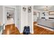Charming foyer featuring hardwood floors leading to a cozy living area and dining room, offering a warm welcome at 218 N Bost St, Statesville, NC 28677