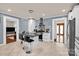 Bright kitchen features a center island with seating, stainless appliances, and lots of storage at 218 N Bost St, Statesville, NC 28677