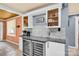 Stylish kitchen area with a wine fridge, sleek countertops, and decorative backsplash, perfect for entertaining at 218 N Bost St, Statesville, NC 28677