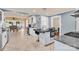 Open kitchen featuring granite countertops, white cabinets, and stainless steel appliances with eat in dining space at 218 N Bost St, Statesville, NC 28677
