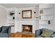 Cozy living room showcasing a fireplace flanked by custom built-in shelves, perfect for displaying decor at 218 N Bost St, Statesville, NC 28677