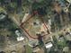 Aerial view of property showcasing the lot with home outlined in red at 306 E Burnsville St, Wadesboro, NC 28170